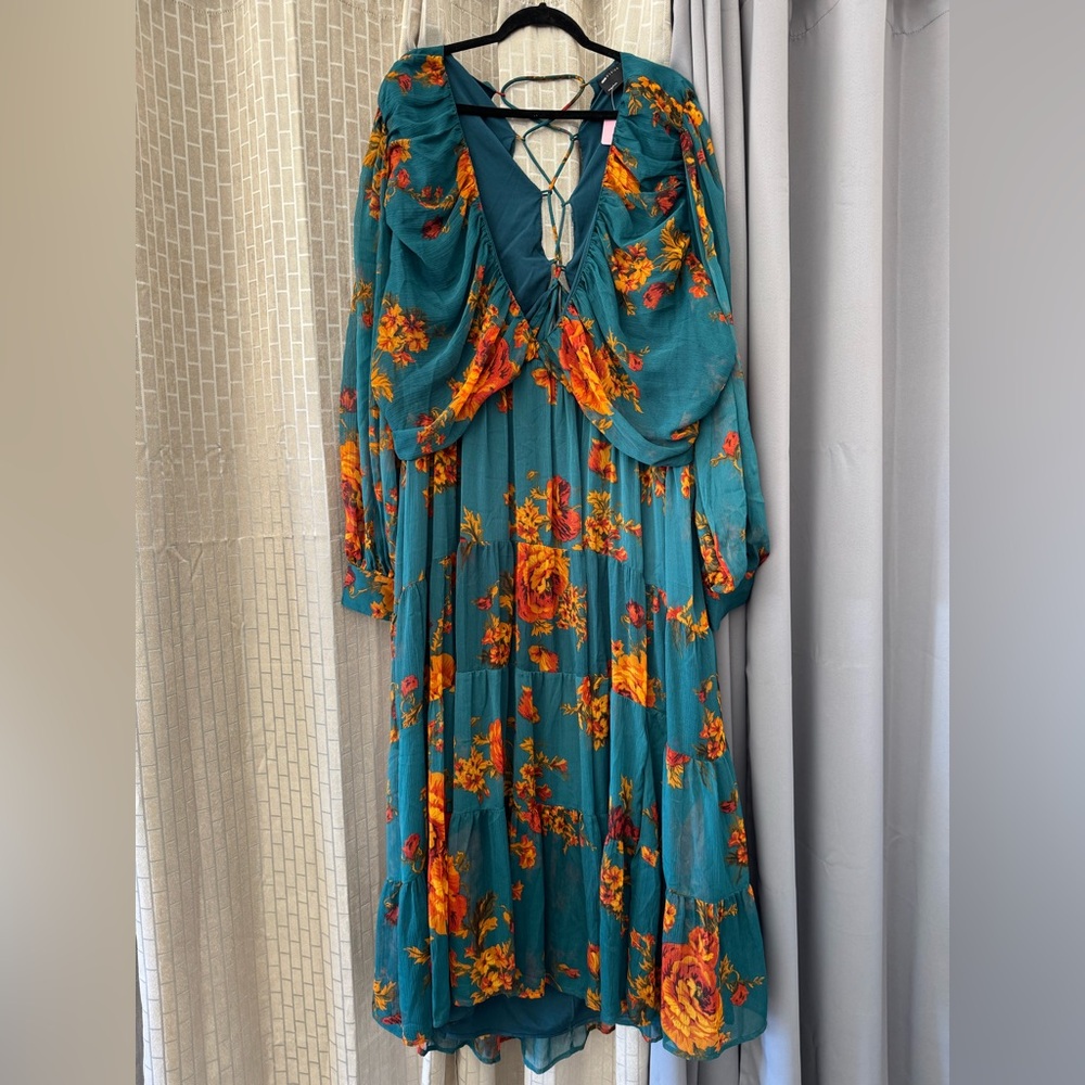 Beautiful blue,orange,red,green dress 
A corset back tie — very flowing—